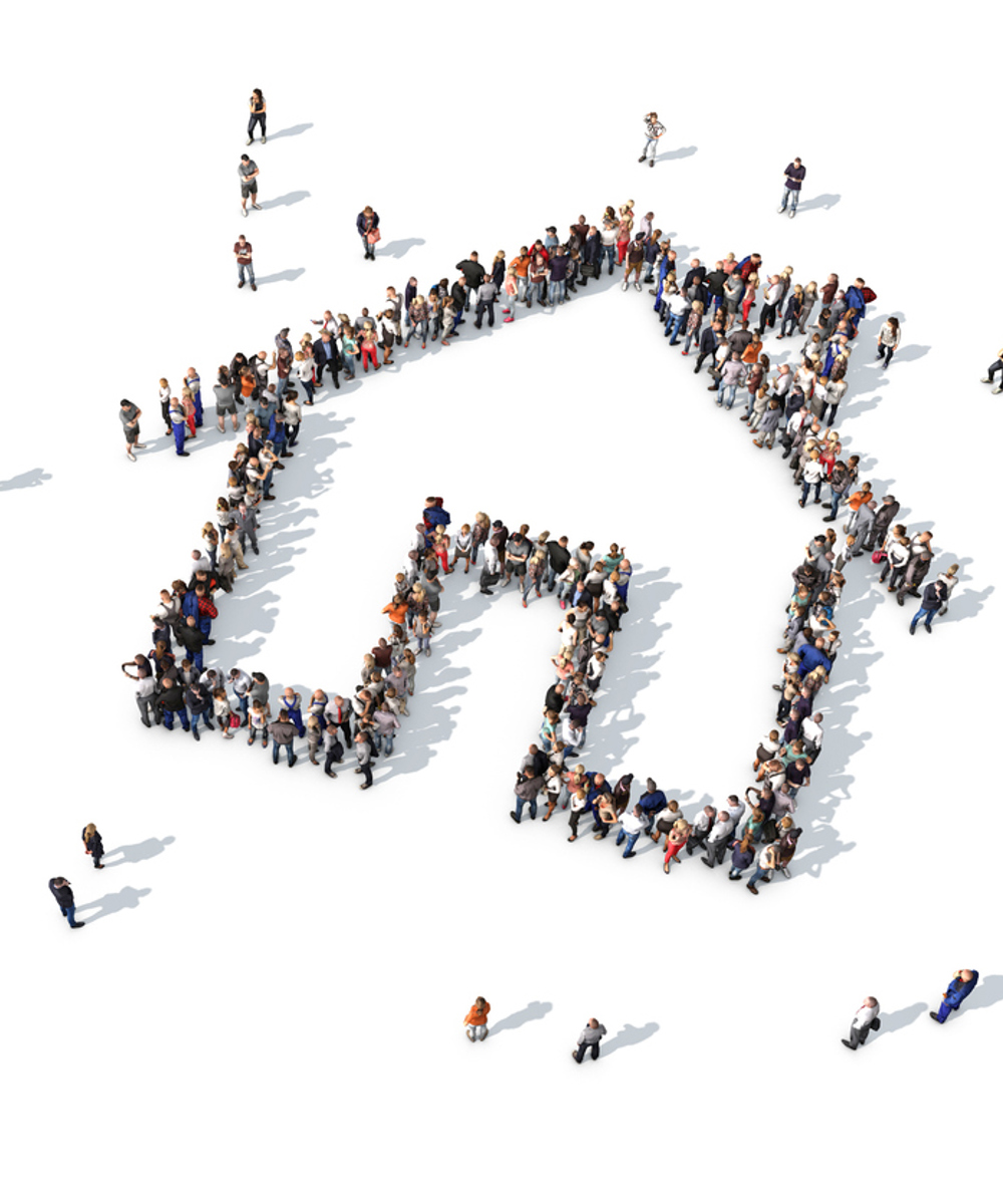 View of a crowd of tenants from above forming the shape of a home 